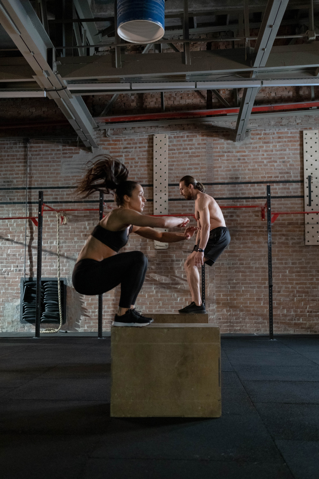 Man and Woman Practicing Plyometrics